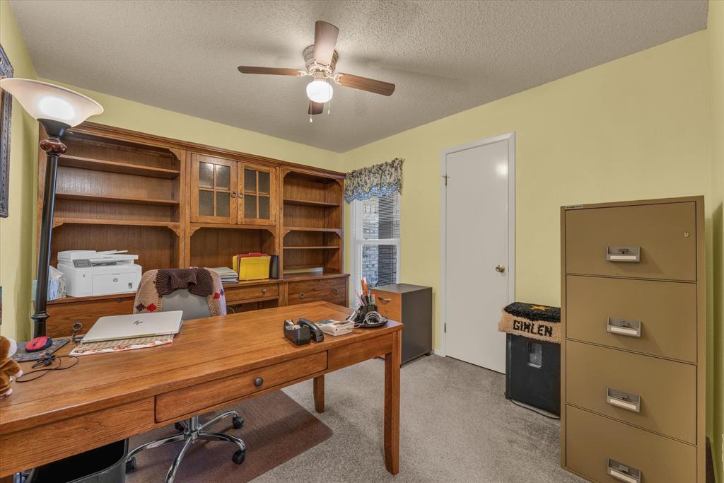 107 Fort Graham Circle Waco, TX 76705 - Photo 20 of 40 Bedroom used as office space featuring light carpet, a textured ceiling, and ceiling fan