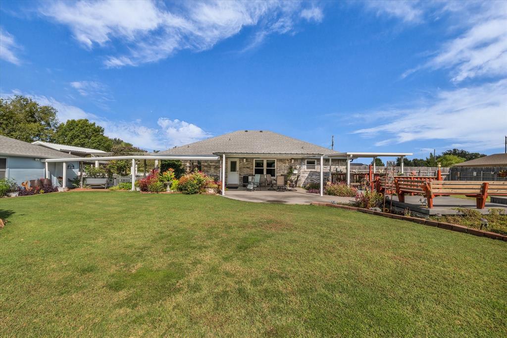 107 Fort Graham Circle Waco, TX 76705 - Photo 23 of 40 Back of property with a patio area