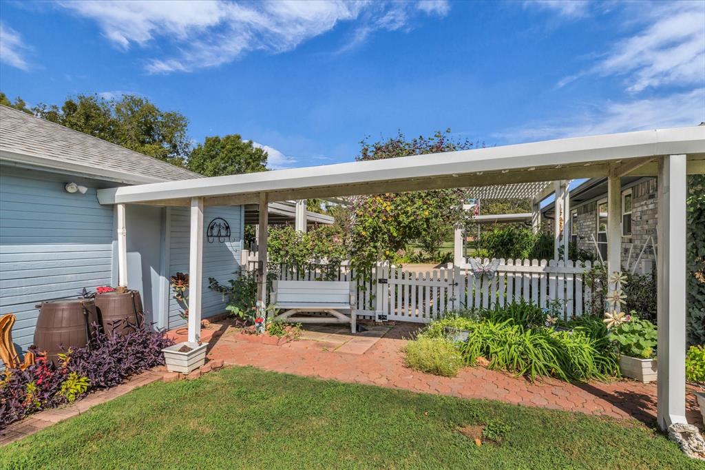 107 Fort Graham Circle Waco, TX 76705 - Photo 33 of 40 View of patio walkway / terrace featuring a gate