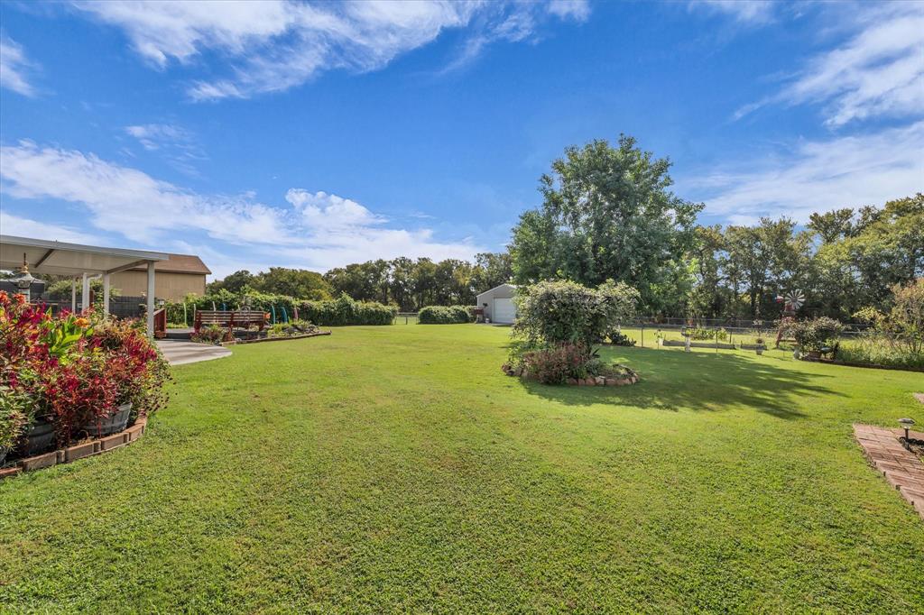 107 Fort Graham Circle Waco, TX 76705 - Photo 35 of 40 View of yard featuring outbuildings