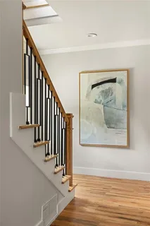 a view of wooden floor with staircase