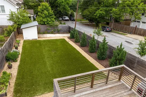 a view of a backyard with sitting area