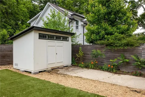 a view of a wooden door and a yard