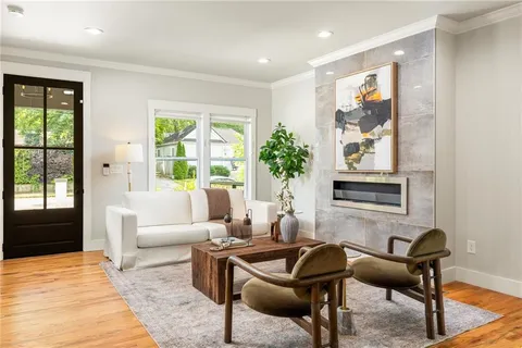 a living room with furniture and a large window