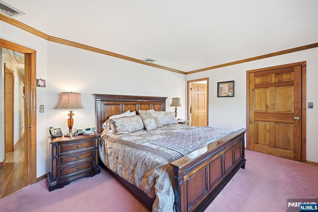 49 Mill Road Park Ridge, NJ 07656 - Photo 13 of 34 a bedroom with a bed and a dresser