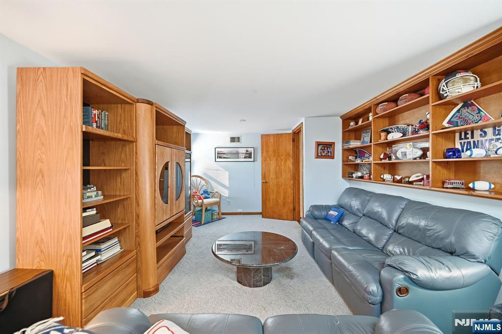 49 Mill Road Park Ridge, NJ 07656 - Photo 22 of 34 a living room with furniture and a wooden floor