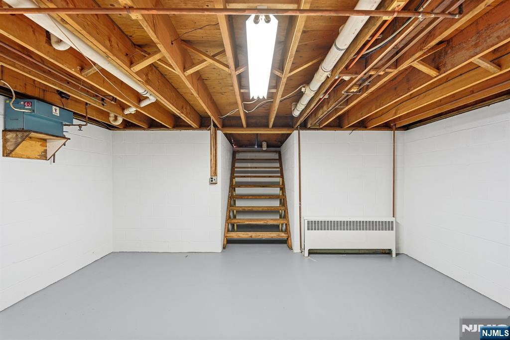 49 Mill Road Park Ridge, NJ 07656 - Photo 27 of 34 a view of room with stairs and a chandelier