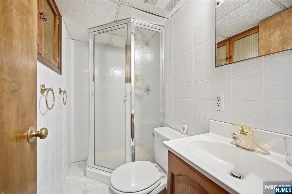 49 Mill Road Park Ridge, NJ 07656 - Photo 28 of 34 a bathroom with a sink toilet and shower