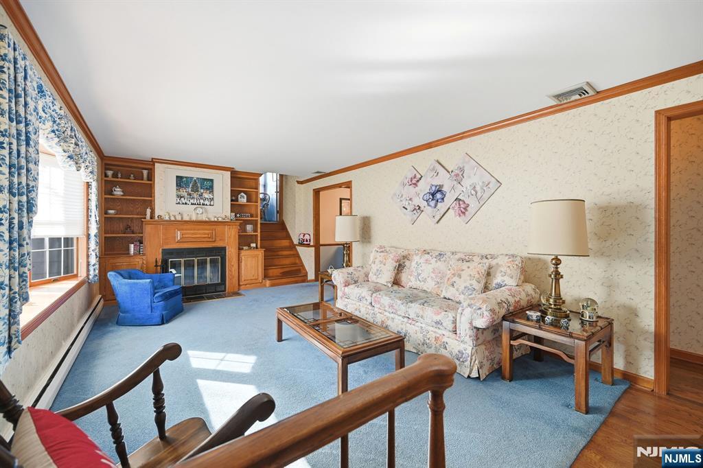 49 Mill Road Park Ridge, NJ 07656 - Photo 3 of 34 a living room with furniture fireplace and a large window