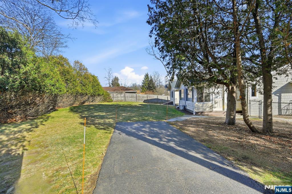 49 Mill Road Park Ridge, NJ 07656 - Photo 34 of 34 a view of a yard with plants and a tree