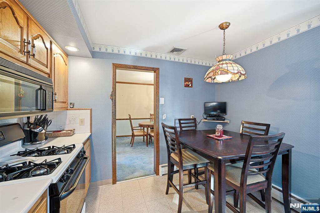 49 Mill Road Park Ridge, NJ 07656 - Photo 7 of 34 a view of a dining room and a table and chairs