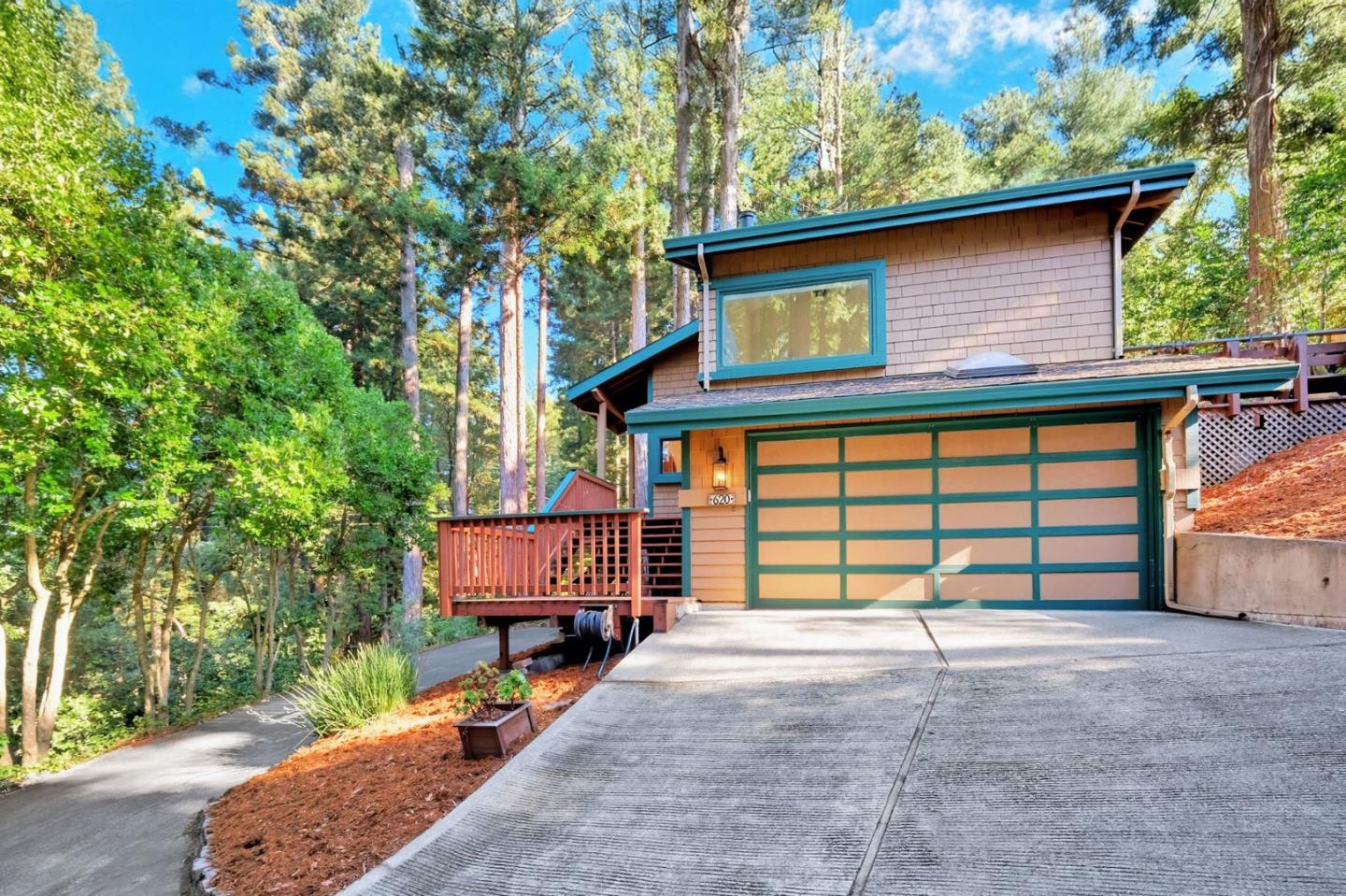 620 Condor Avenue Ben Lomond, CA 95005 - Photo 1 of 42 a front view of a house with a yard and garage