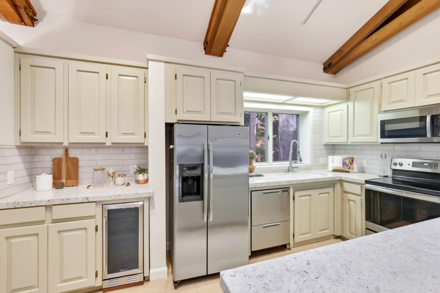 620 Condor Avenue Ben Lomond, CA 95005 - Photo 11 of 42 a kitchen with stainless steel appliances granite countertop a sink a stove a refrigerator with grey cabinets
