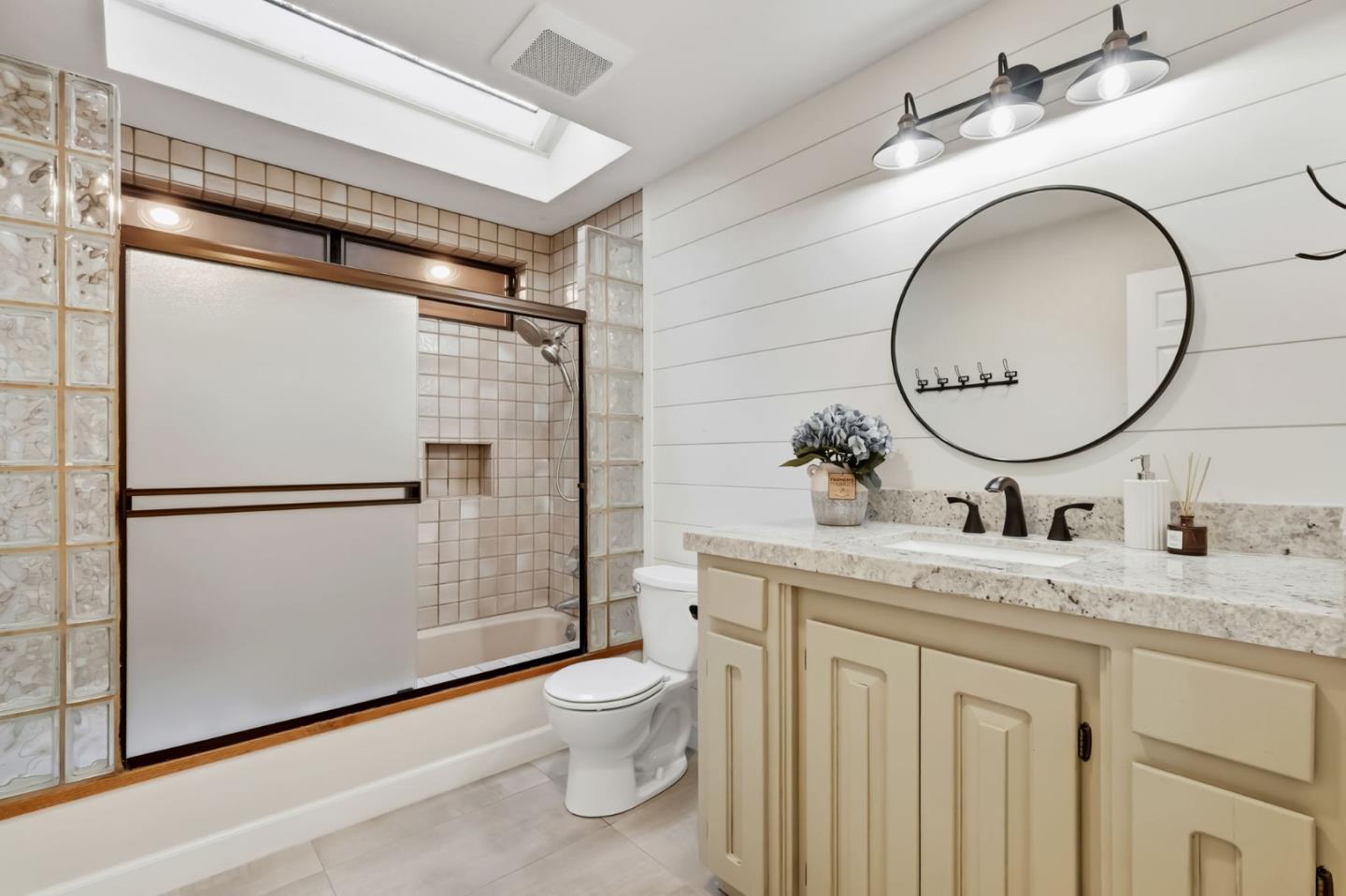 620 Condor Avenue Ben Lomond, CA 95005 - Photo 24 of 42 a bathroom with a granite countertop sink mirror vanity and toilet