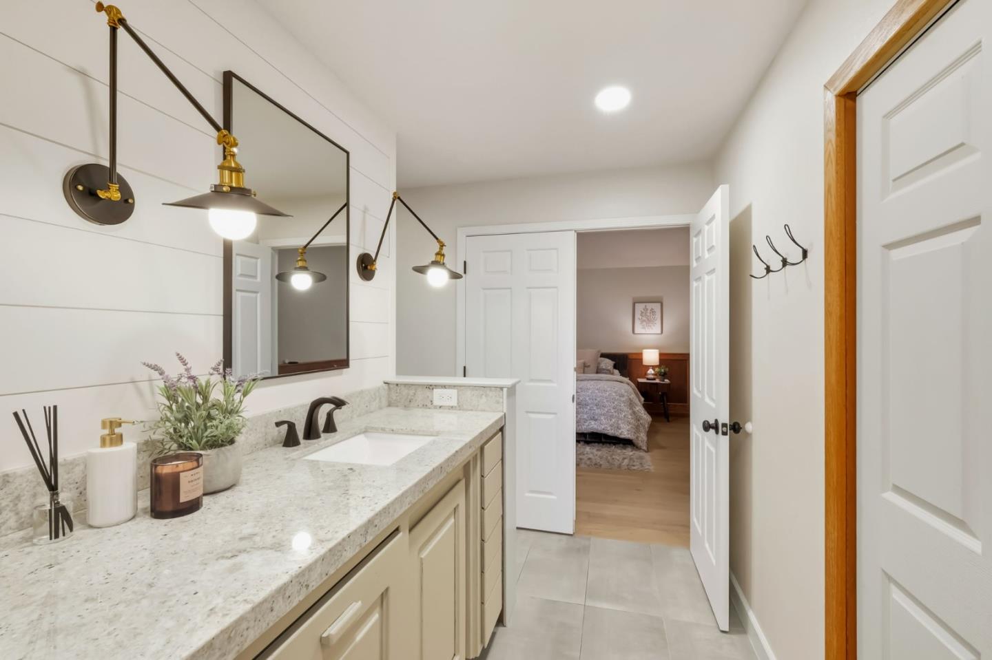 620 Condor Avenue Ben Lomond, CA 95005 - Photo 26 of 42 a en suite bathroom with a granite countertop sink and a mirror
