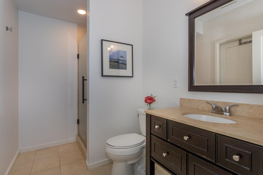 12 Endicott Place Canton, MA 02021 - Photo 14 of 17 a bathroom with a toilet sink vanity and mirror