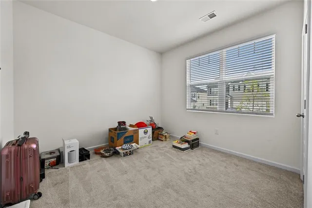 a view of room with toys and a window