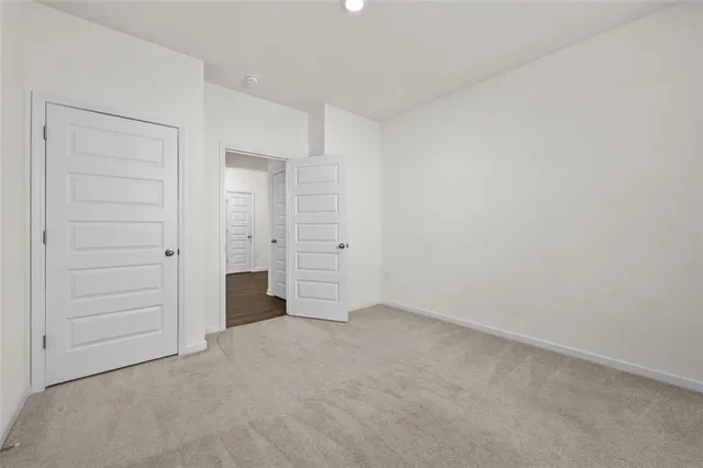 a view of a patio with dining table and chairs