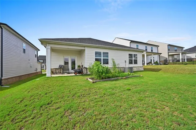 a front view of house with yard and green space