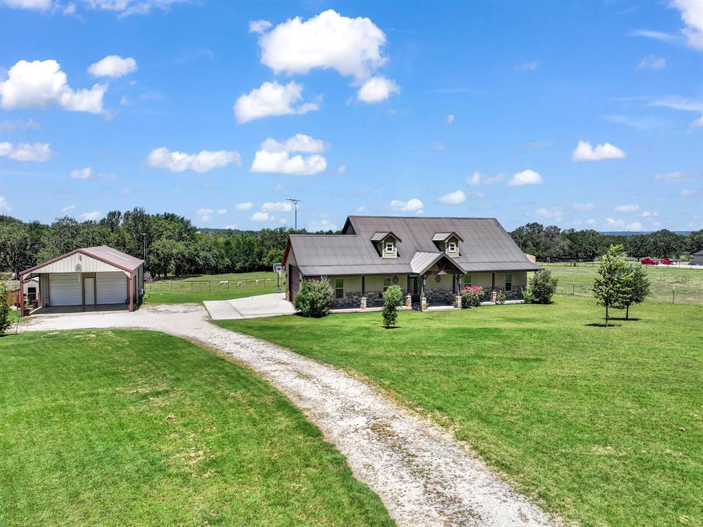 854 County Road 3330 Bridgeport, TX 76426 - Photo 2 of 40 6 Bedrooms 3 Baths office Dining 2 Car garage shop w/Living Quarters 2 stall loafing shed chicken coop fenced and cross fenced!