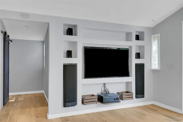 a view of a porch with chairs and backyard
