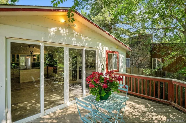 a view of a wooden deck with a yard