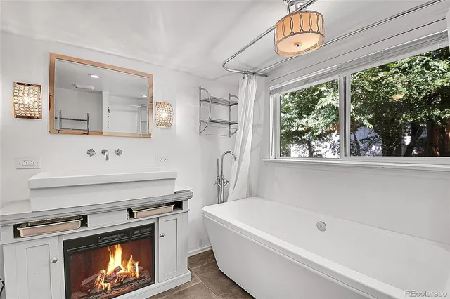 a view of a room with wooden floor and windows