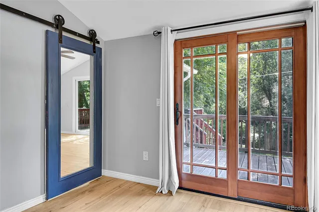 a view of a wooden deck front of house