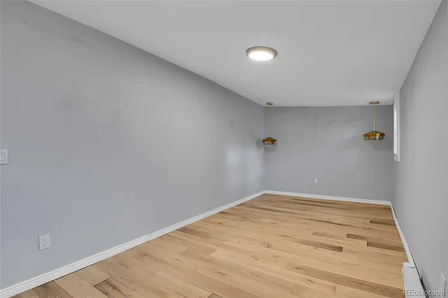 a house with wooden deck front of house