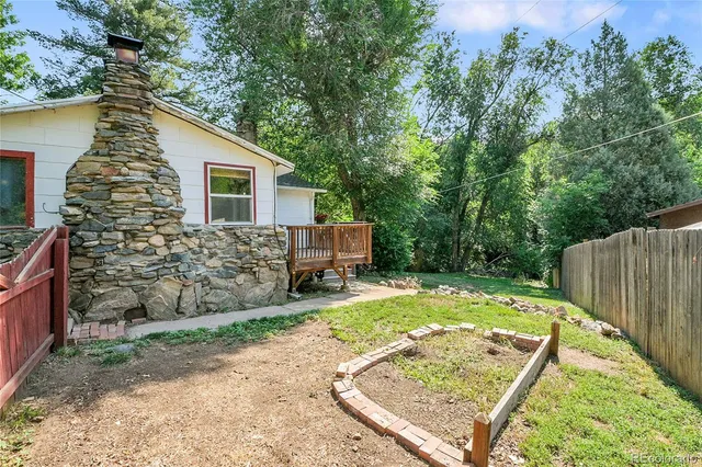 a house with trees in the background