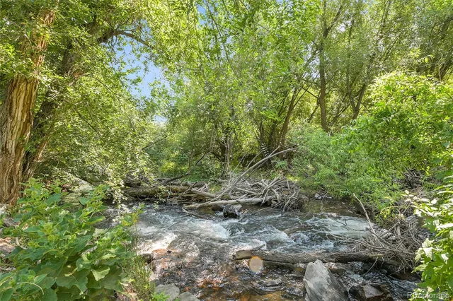 a aerial view of a house with a yard