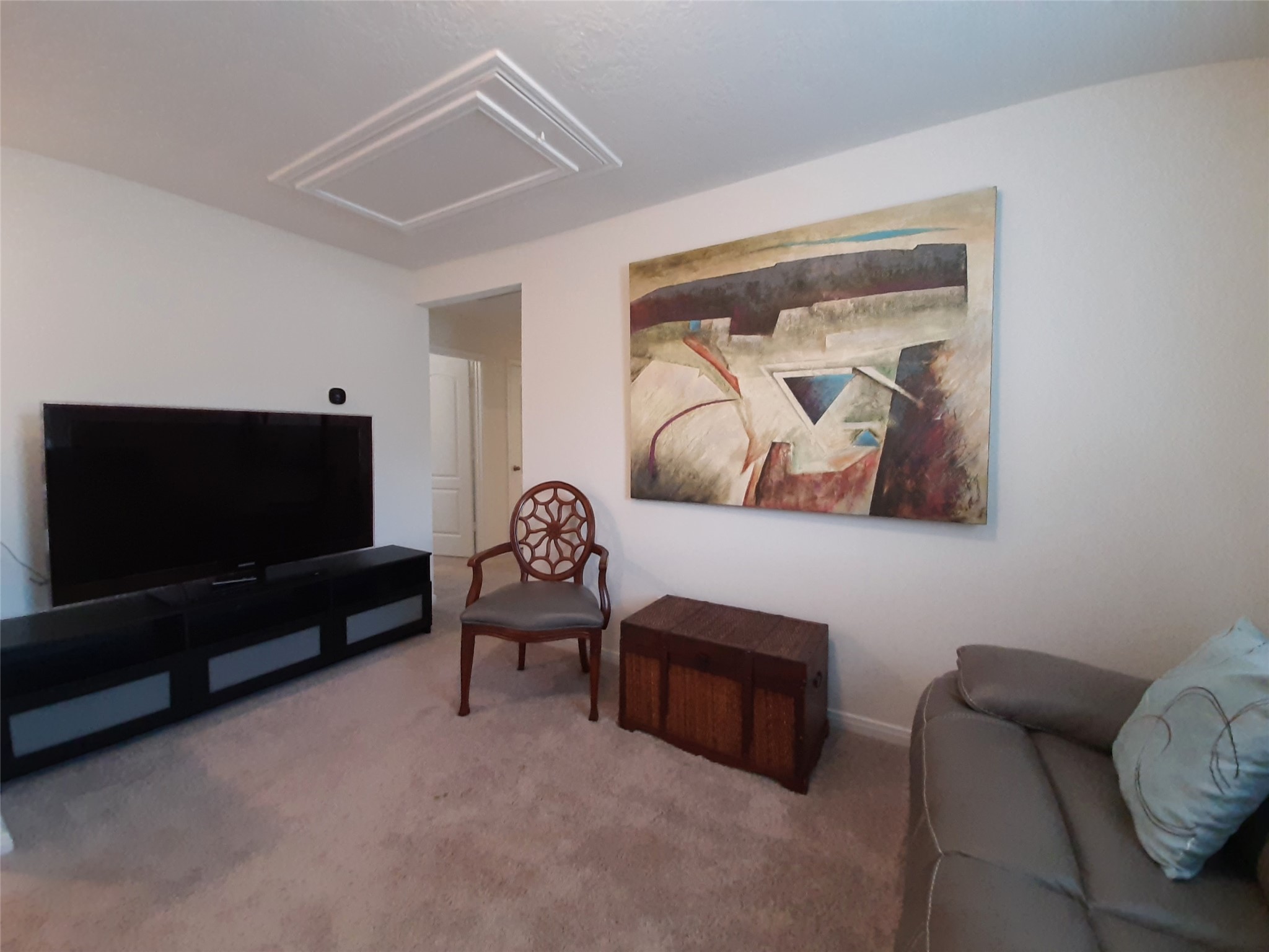 3322 Forest Chitto Dr Spring Spring, TX 77373 - Photo 15 of 18 a living room with furniture and a flat screen tv