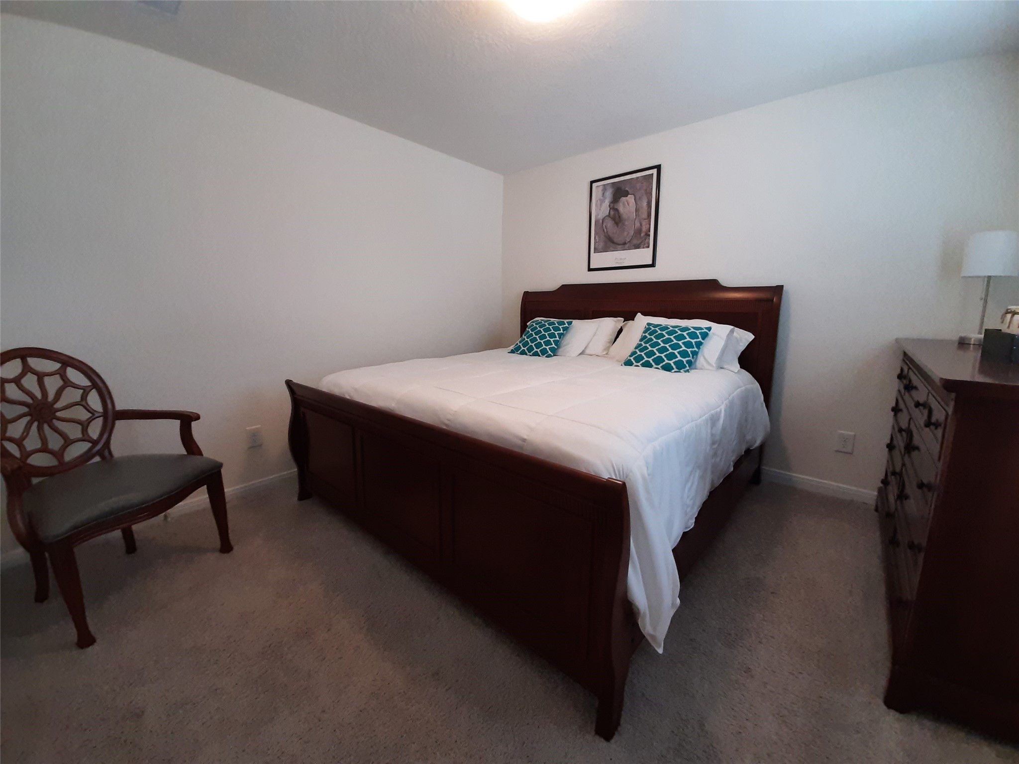 3322 Forest Chitto Dr Spring Spring, TX 77373 - Photo 16 of 18 a bedroom with a bed and a chair