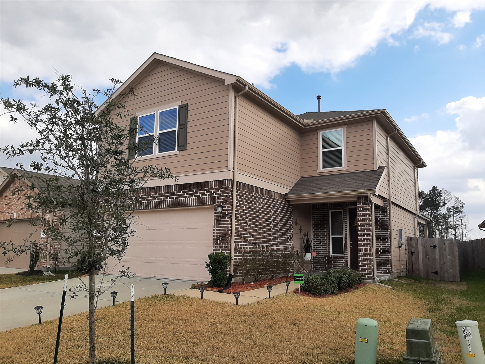 3322 Forest Chitto Dr Spring Spring, TX 77373 - Photo 2 of 18 a front view of a house with a yard