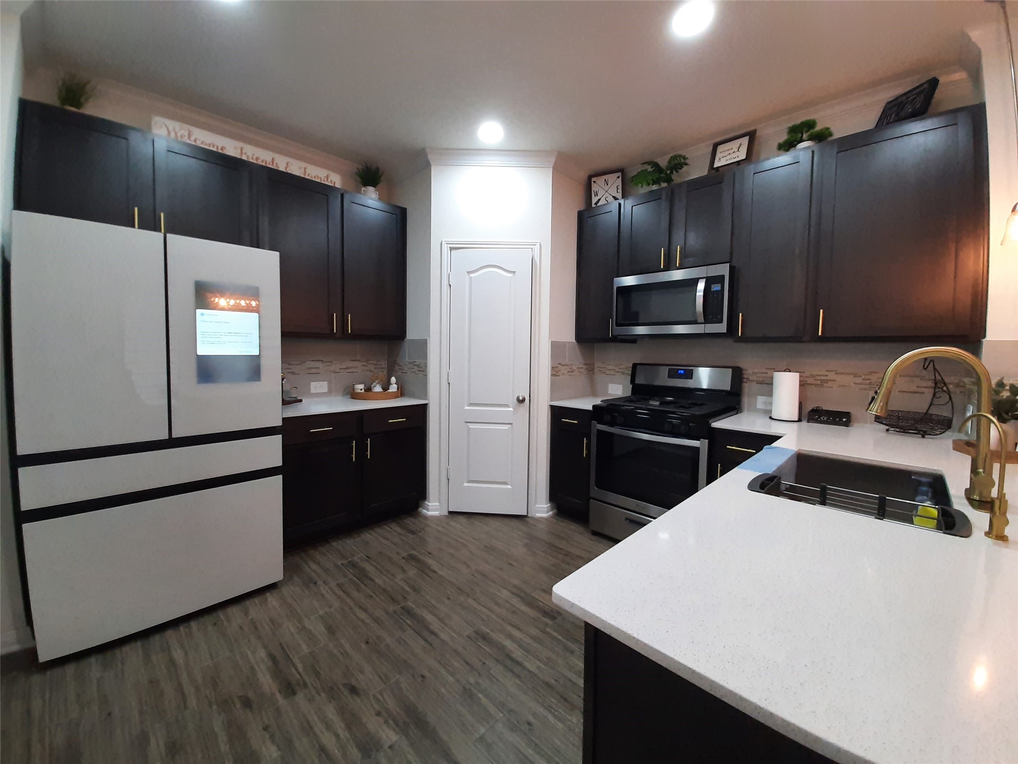 3322 Forest Chitto Dr Spring Spring, TX 77373 - Photo 9 of 18 a kitchen with a refrigerator and a stove top oven