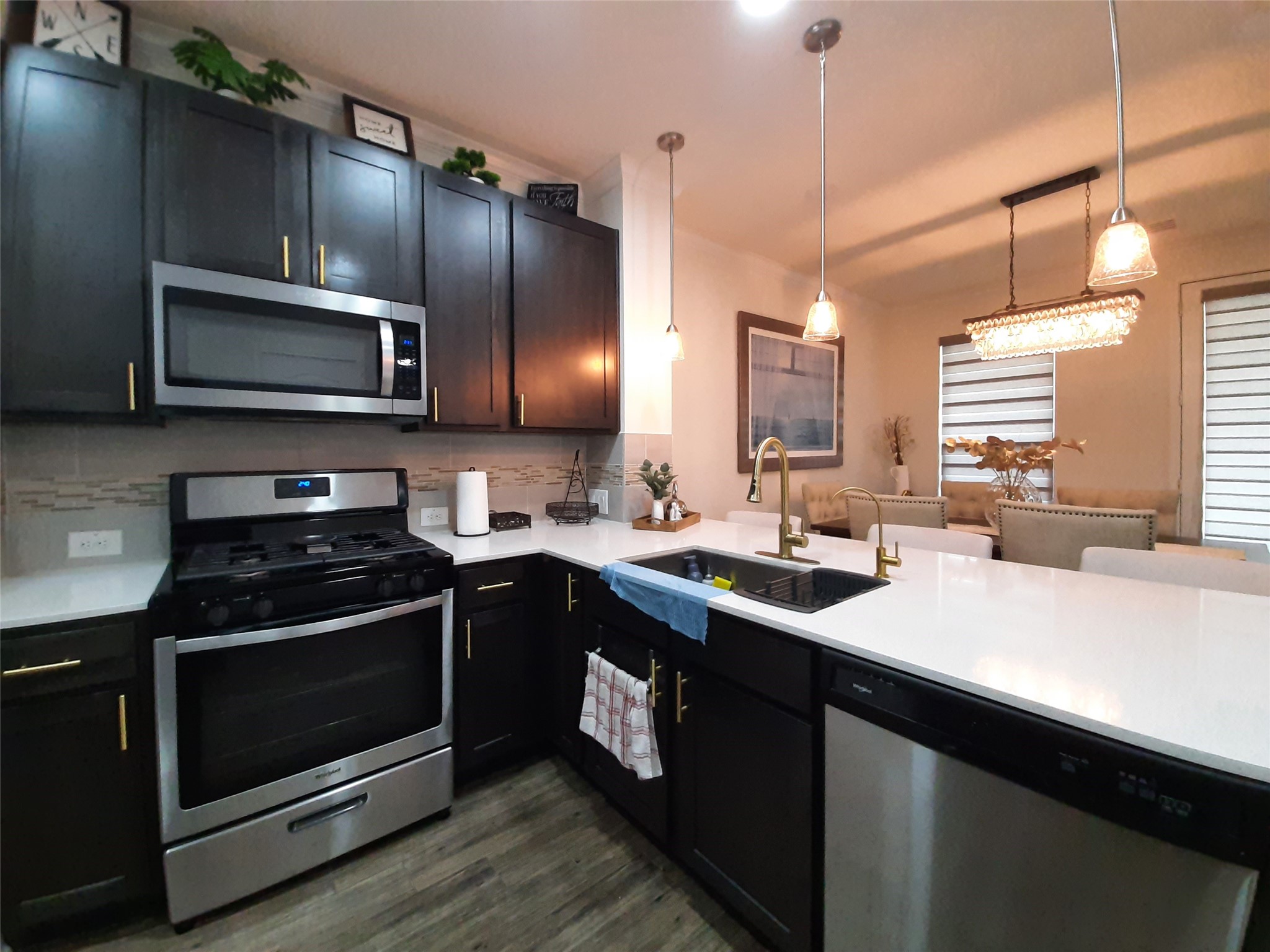 3322 Forest Chitto Dr Spring Spring, TX 77373 - Photo 10 of 18 a kitchen with a sink stove and microwave