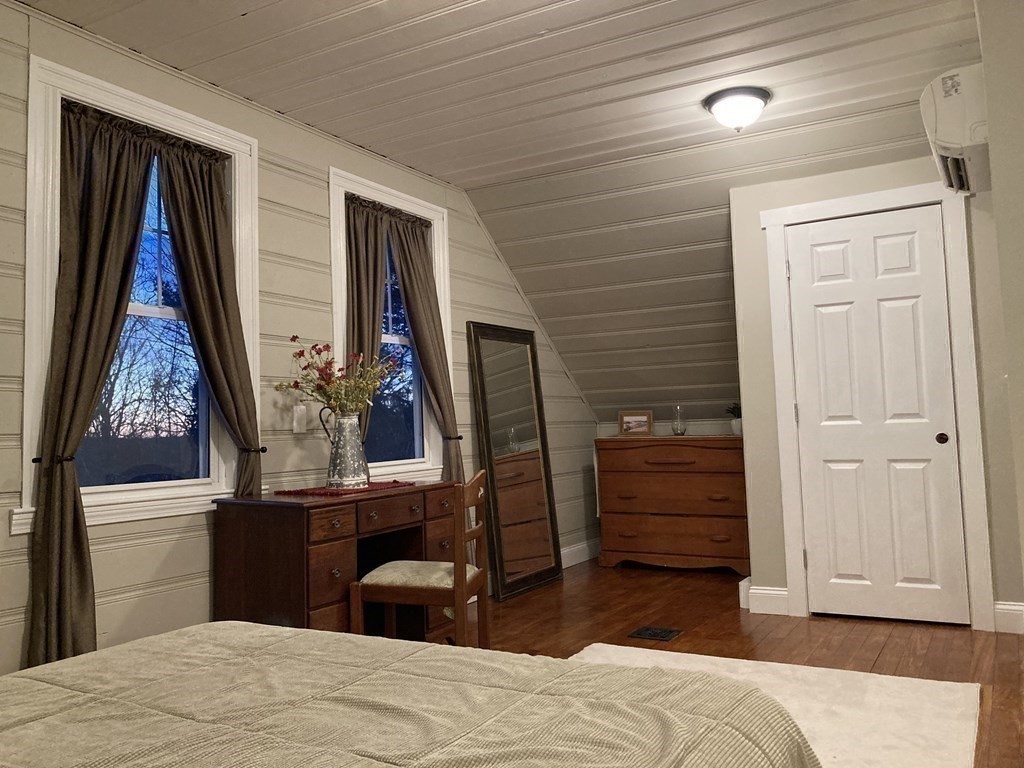 3 Pine Street Gardner, MA 01440 - Photo 21 of 32 a bedroom with a bed and a mirror