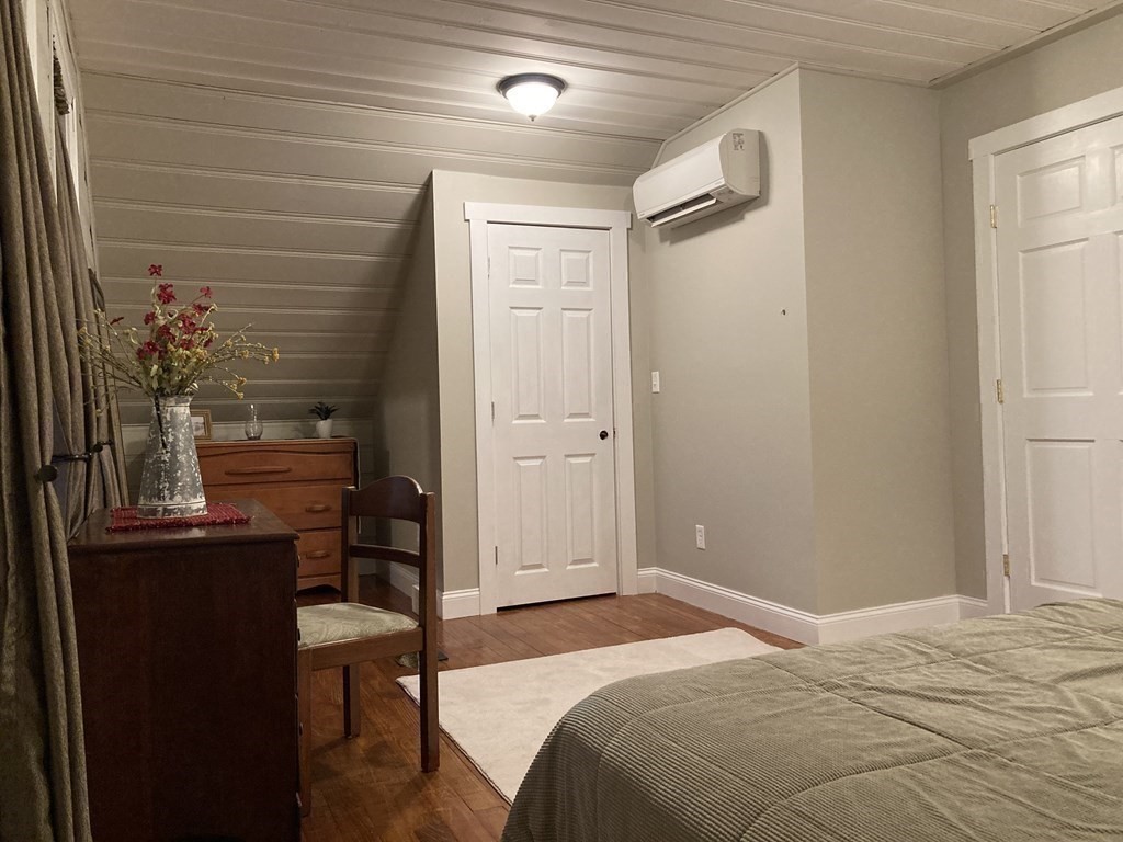 3 Pine Street Gardner, MA 01440 - Photo 23 of 32 a bedroom with a bed and a table