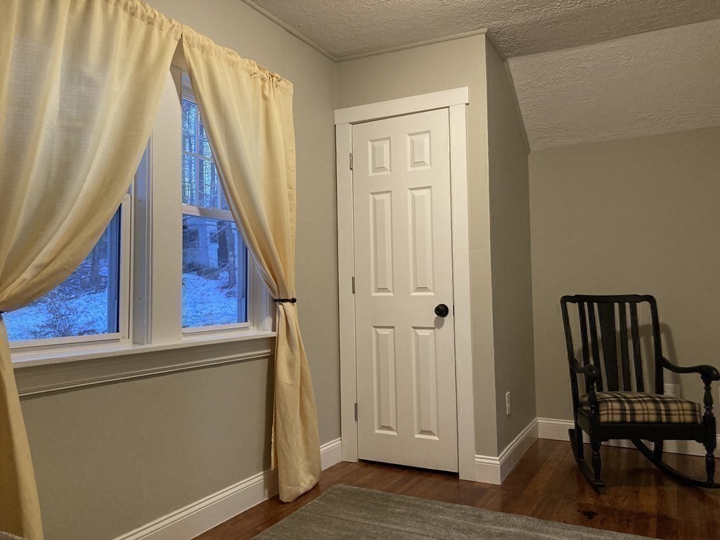 3 Pine Street Gardner, MA 01440 - Photo 25 of 32 a view of a room with furniture and wooden floor