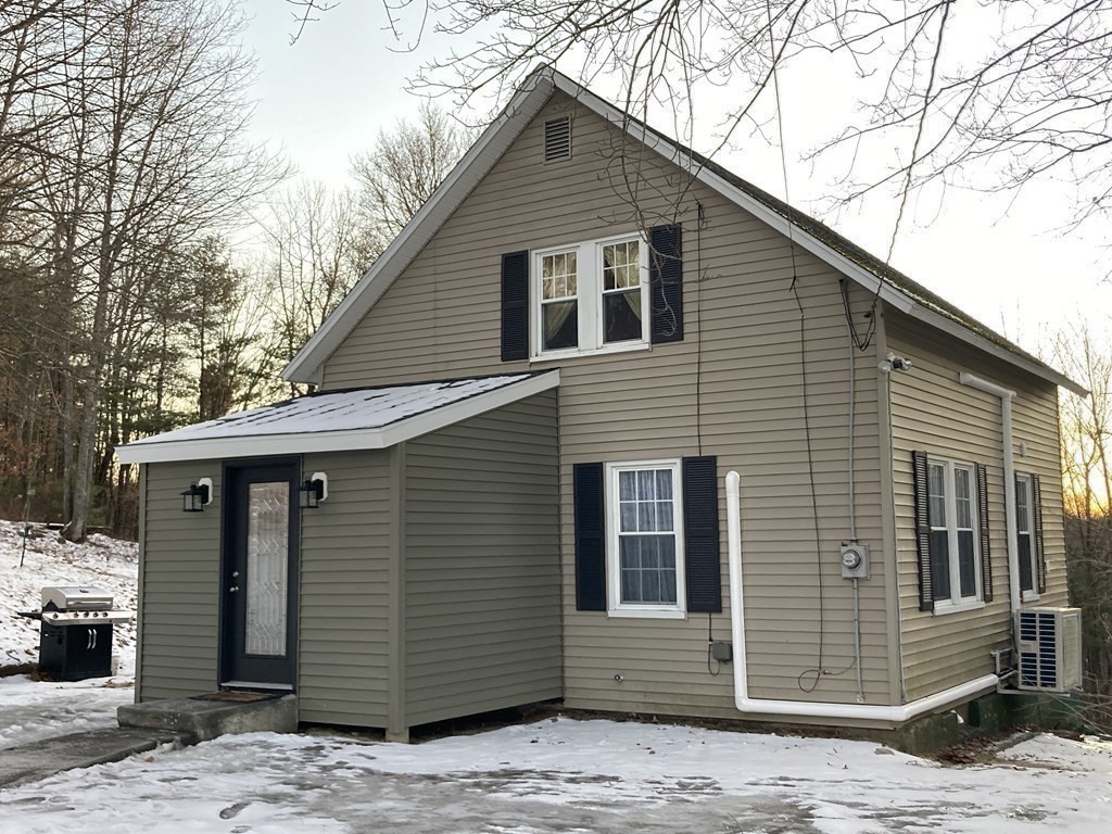 3 Pine Street Gardner, MA 01440 - Photo 3 of 32 a front view of a house with a wooden fence