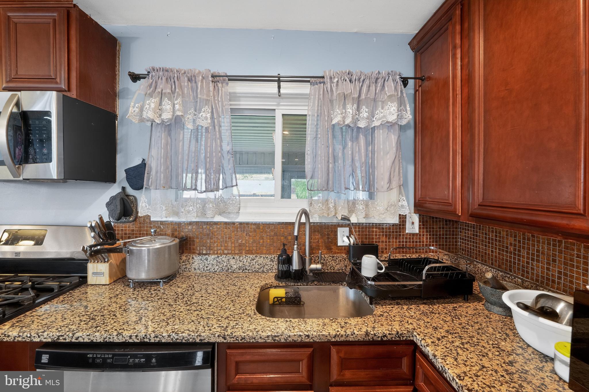 5909 Charnwood Road Catonsville, MD 21228 - Photo 14 of 31 Charming kitchen with modern touches.