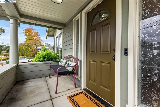 a view of an empty room with window and fire place