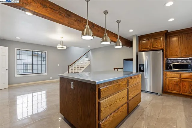 a view of a livingroom with furniture wooden floor and windows