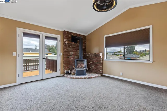 a view of a balcony with wooden floor and fence