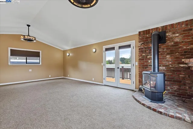 a bathroom with a granite countertop toilet a sink and a mirror