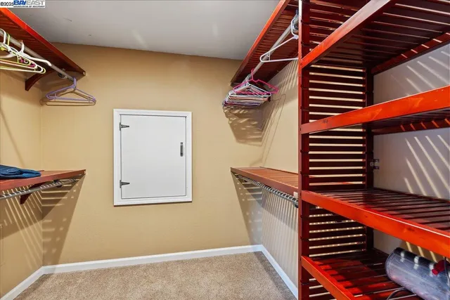 a bedroom with a bed and a with a dresser