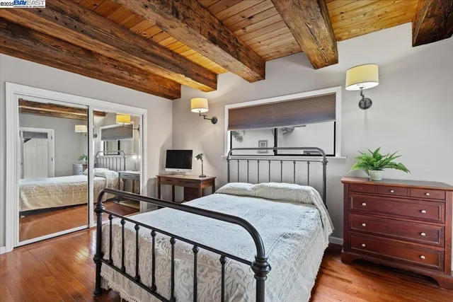 a view of a house with wooden fence