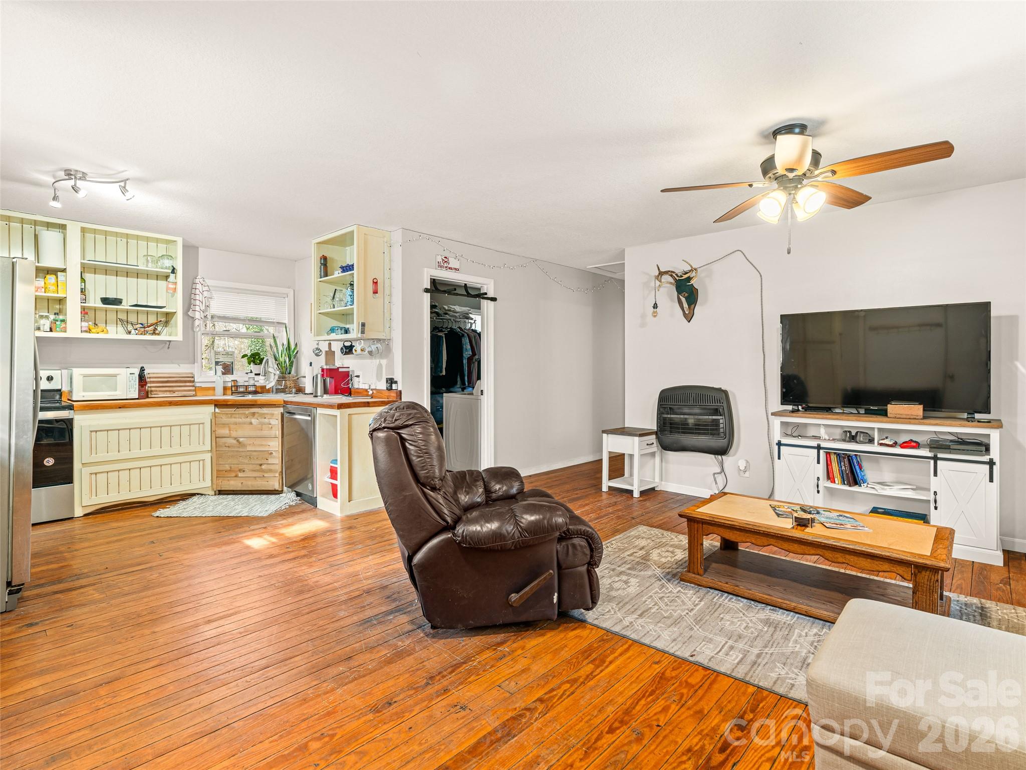 6 Nelson Road Hendersonville, NC 28791 - Photo 14 of 18 a living room with furniture and a flat screen tv
