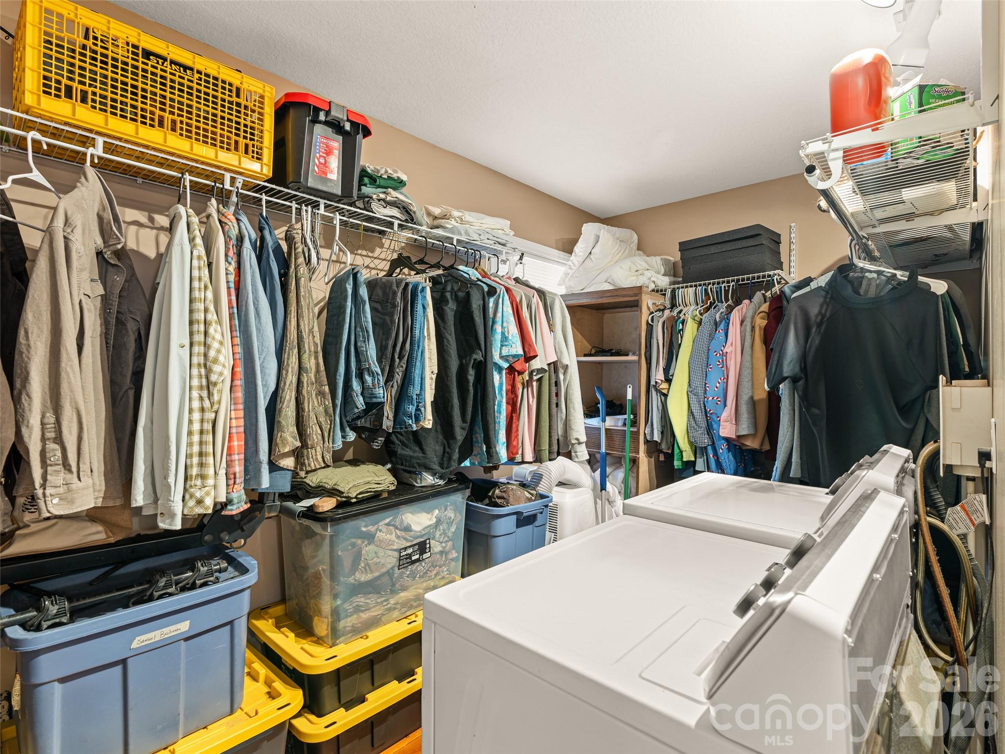 6 Nelson Road Hendersonville, NC 28791 - Photo 15 of 18 a view of walk in closet with clothes and shoes