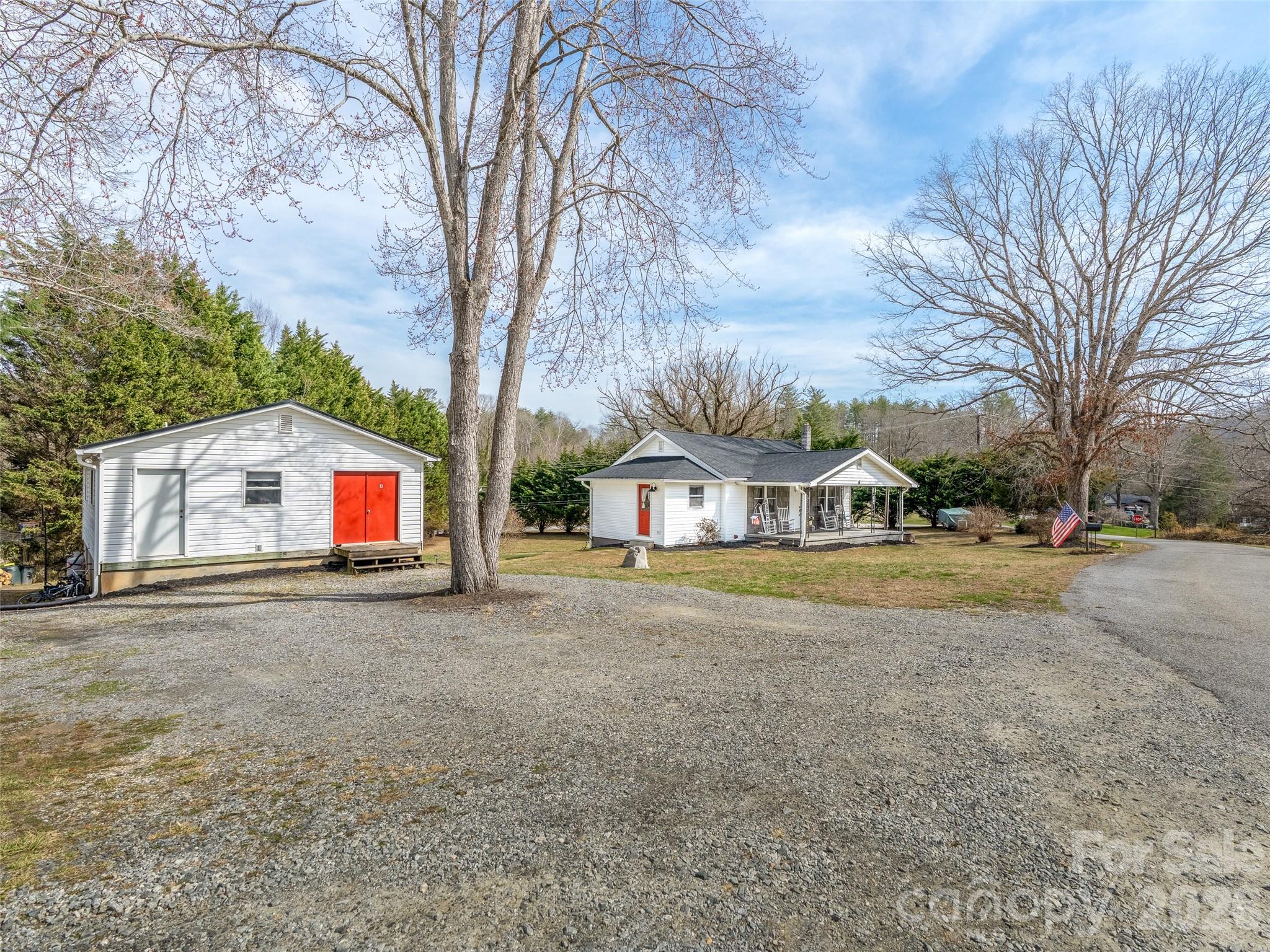 6 Nelson Road Hendersonville, NC 28791 - Photo 2 of 18 a front view of house with yard and trees